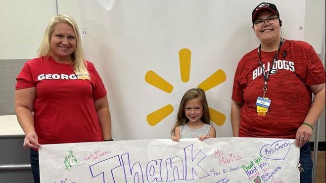 walmart managers and thank you sign